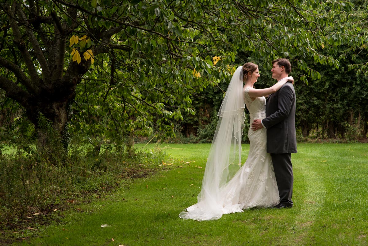 Canterbury wedding Photography - photograph of hannah and Matthew on their wedding day in the orchard