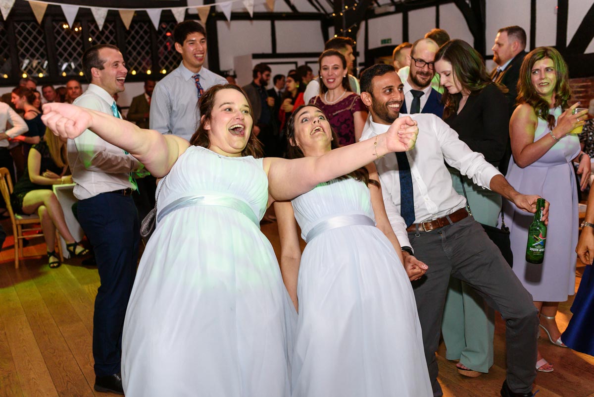 Guest dancing at Ed and Stephanies Chilham Village Hall wedding in Kent