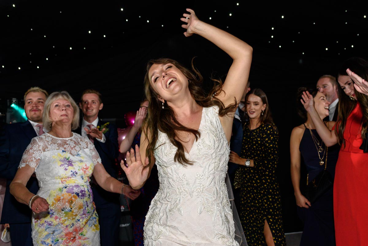 Kailey enjoys the dancing at her Ferry House Inn wedding reception