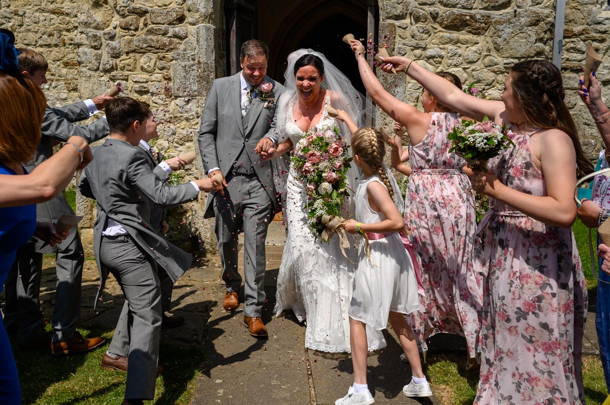 Emma & Chris run through confetti at their Smarden Church wedding in Kent