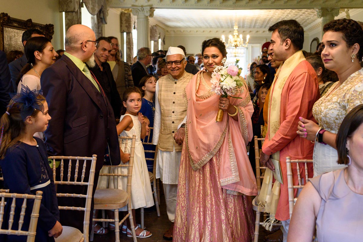 Vinita walked down the aisle by her father at her Chilston park wedding