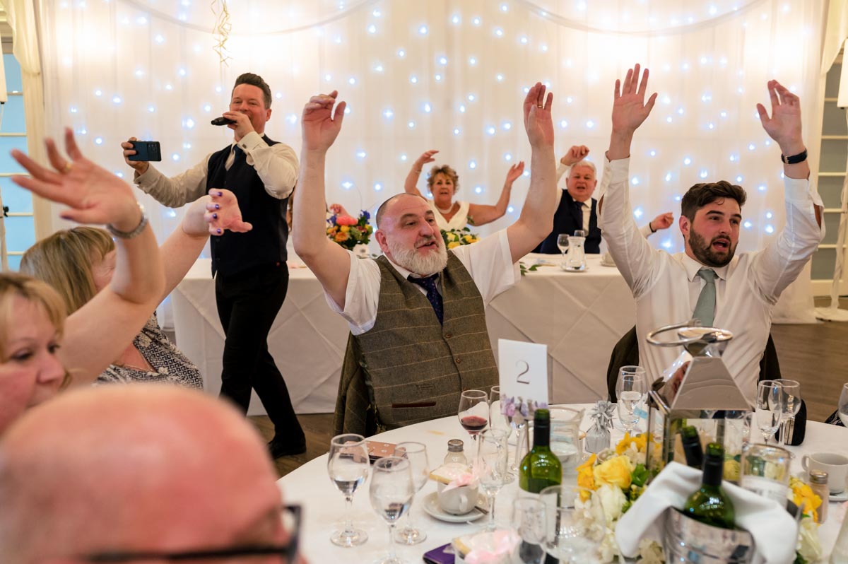 Guests enjoy the best singing waiters at Hythe Imoperial wedding in Kent