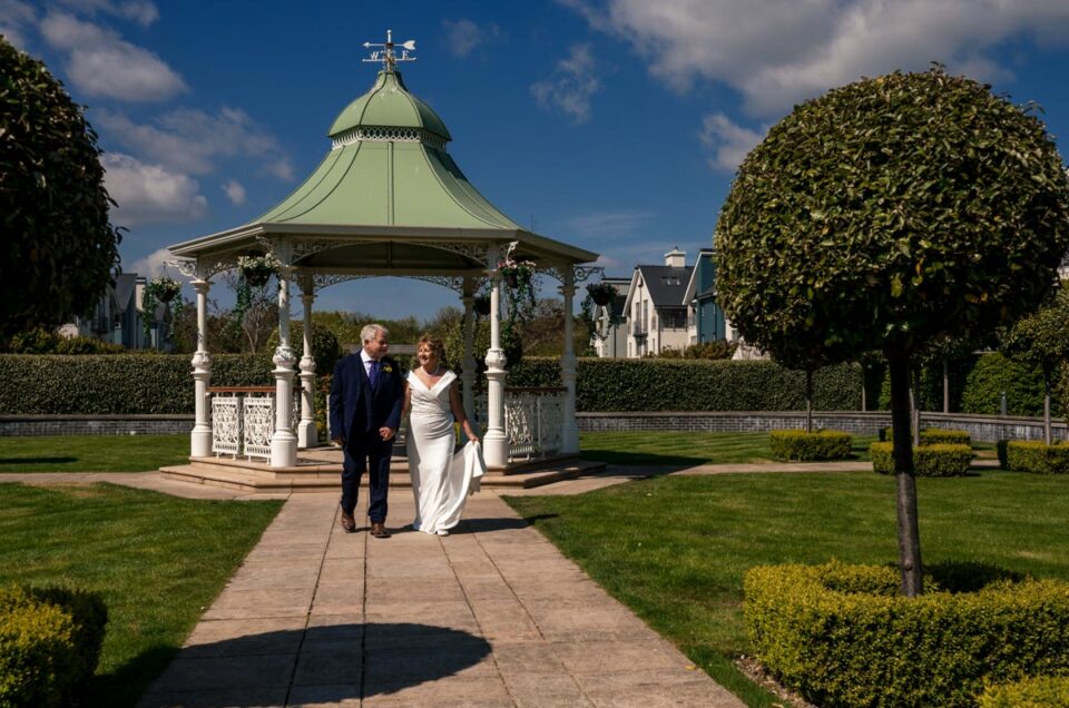 Photograph of Ann and Alan on their wedding day in the gardens of the Hythe Imperial Hotel