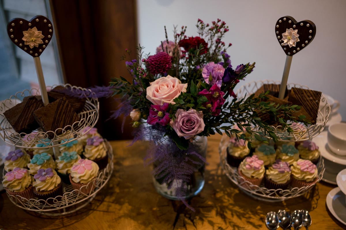 Photograph of wedding flowers atnd cakes at Sophia and Wills Kent wedding