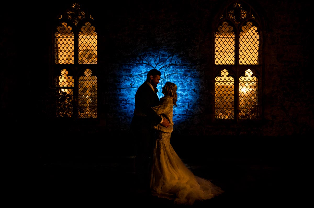 Kent winter wedding. Night portrait of bride and groom at Lympne Castle