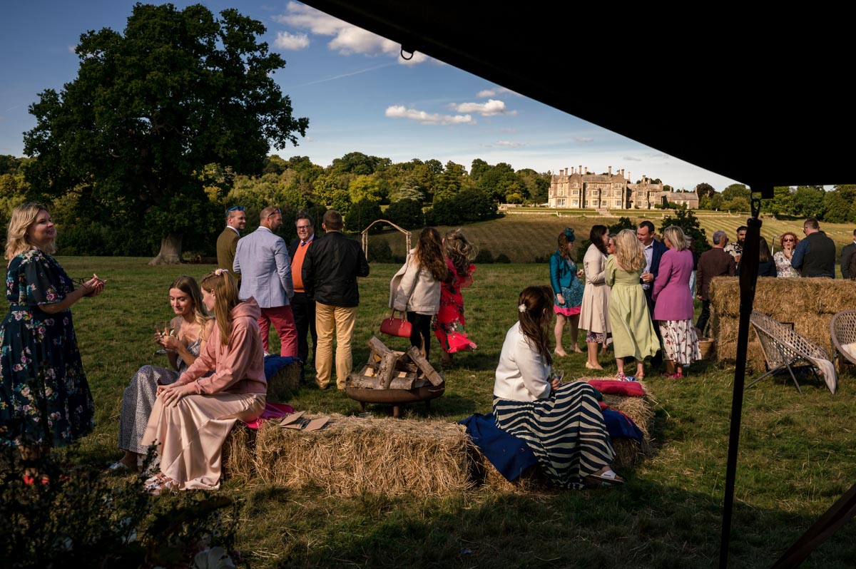 East sussex wedding photography. Guests enjoy countryside surrounds during reception drinks