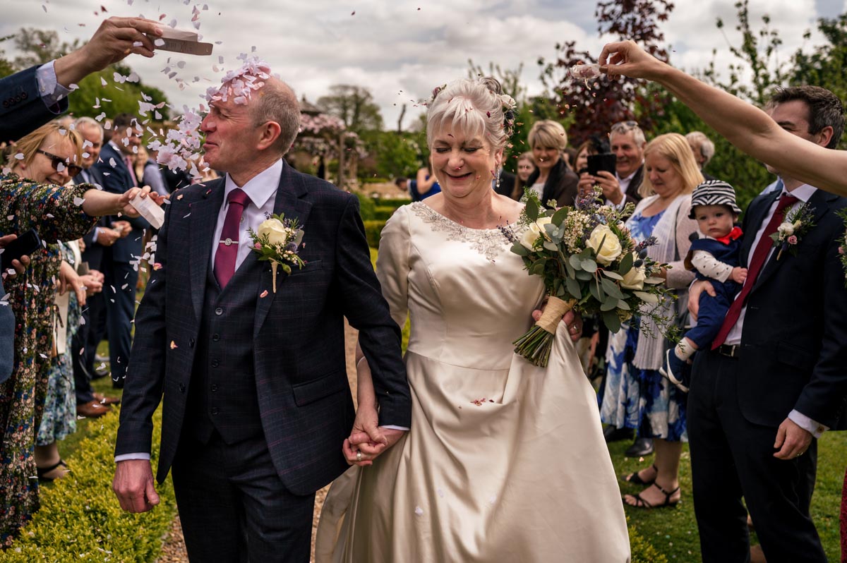 confetti throw at rachel and tonys outdoor ceremony at the secret garden in ashford, kent