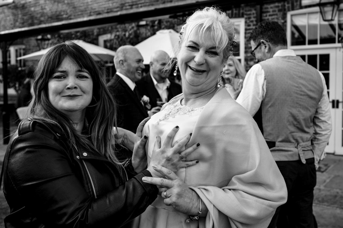 bride and friend at her wedding at the secret garden in kent