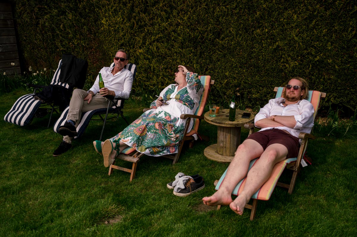 guests photographed relaxing in garden after christening in Kent