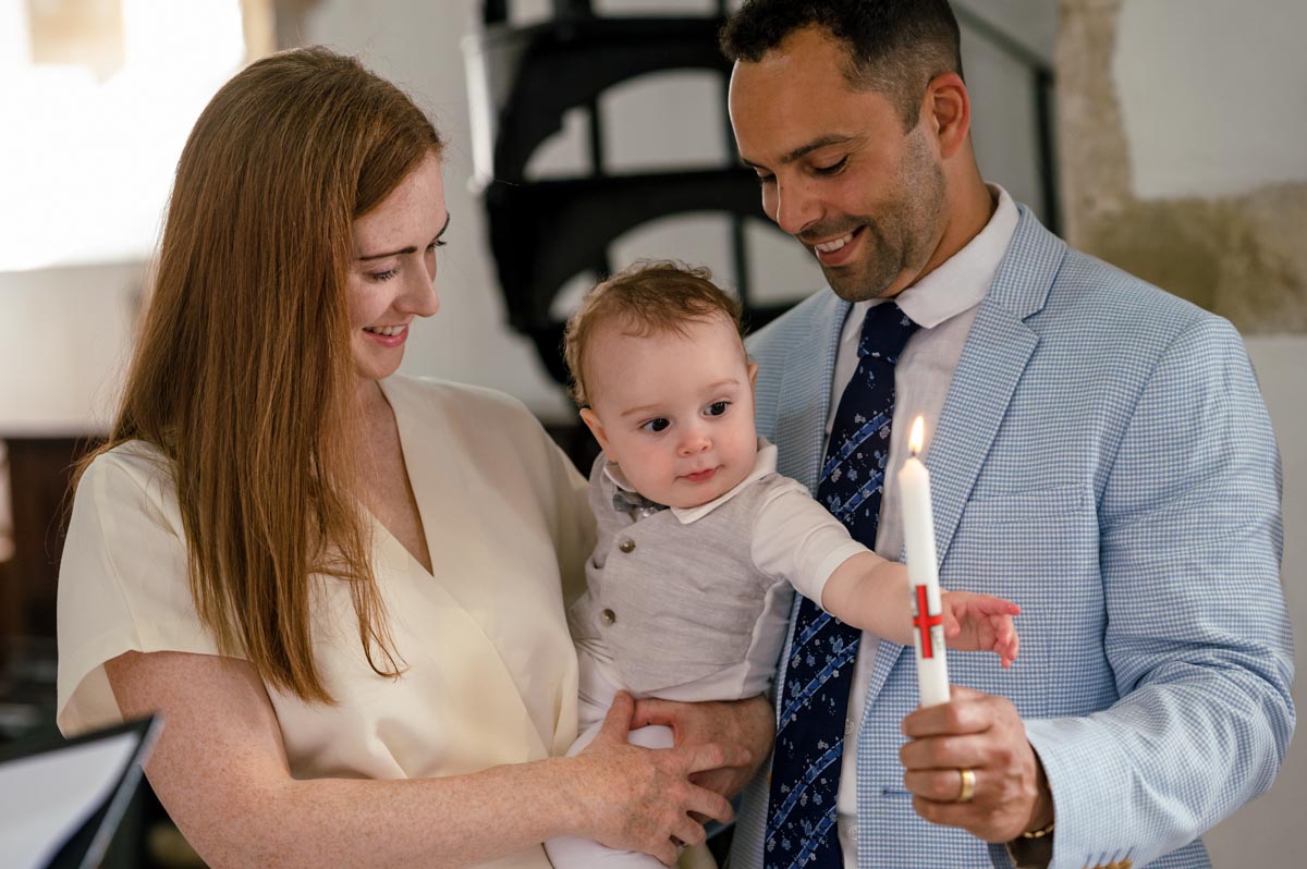 Funny moment as Rupert tries to get hold of commemorative candle during his church christening in Kent