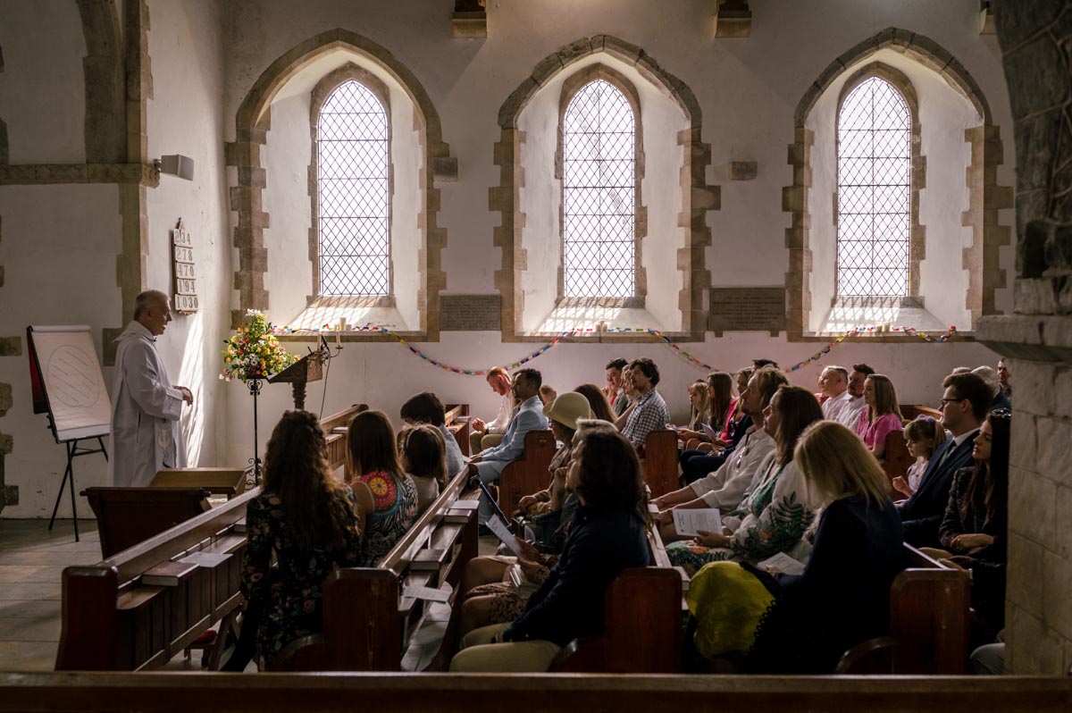 Christening photography Kent. Photograph of whole congregation in church