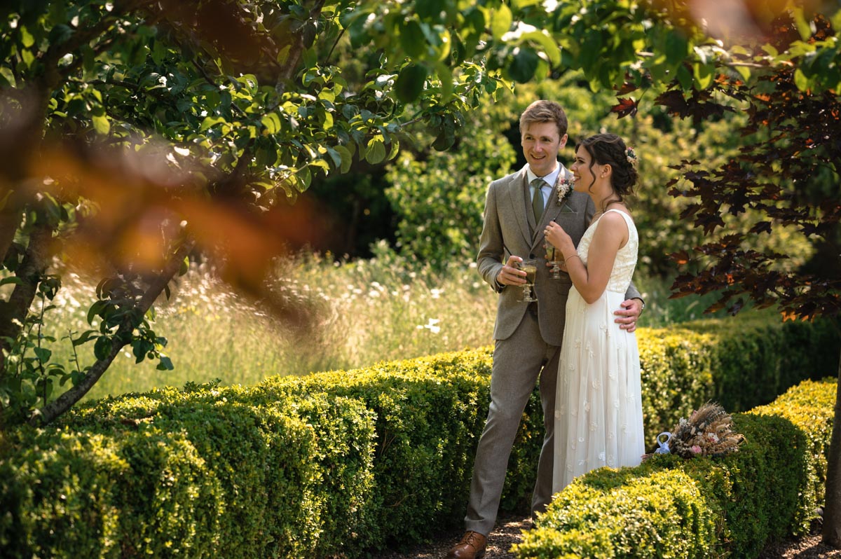 candid wedding photography of fred and becca at their wedding at the secret garden in kent