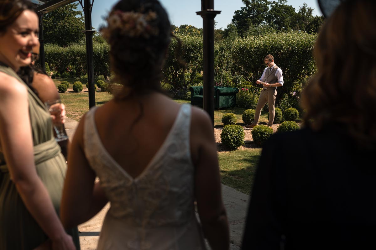 groom makes his speech at the secret garden in kent
