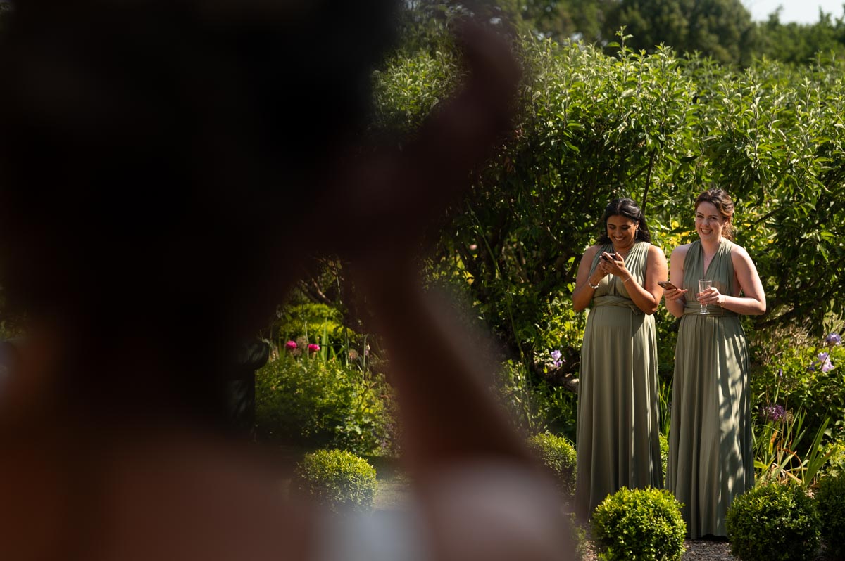 bridemaids photographed doing speeches at fred and beccas wedding at the secret garden in kent