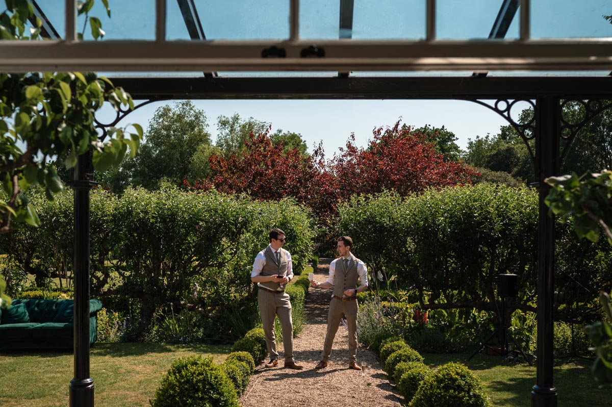 best men make wedding speeches photographed at the secret garden in kent