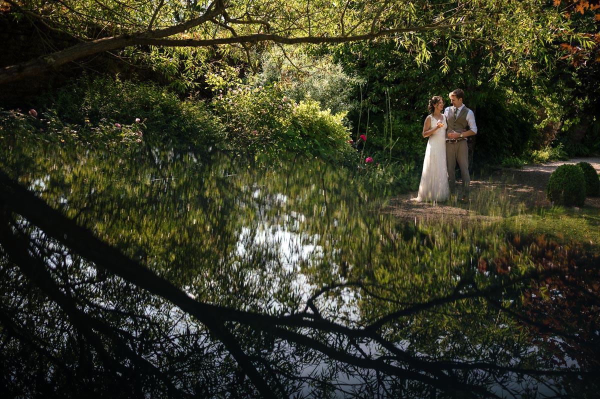 photograph of fred and becca after their wedding ceremony at the secret garden in kent