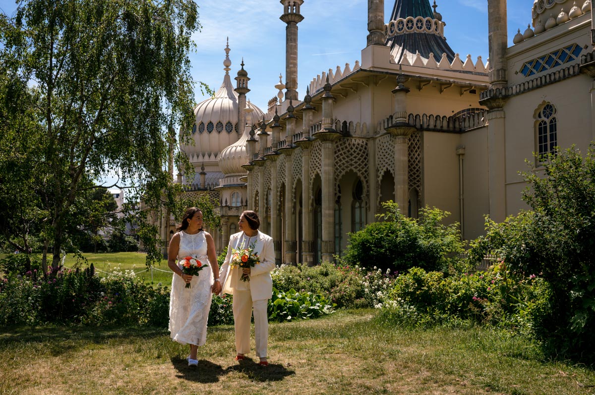 Photograph of brides outside Brighton Royal Pavillion after their wedding ceremony