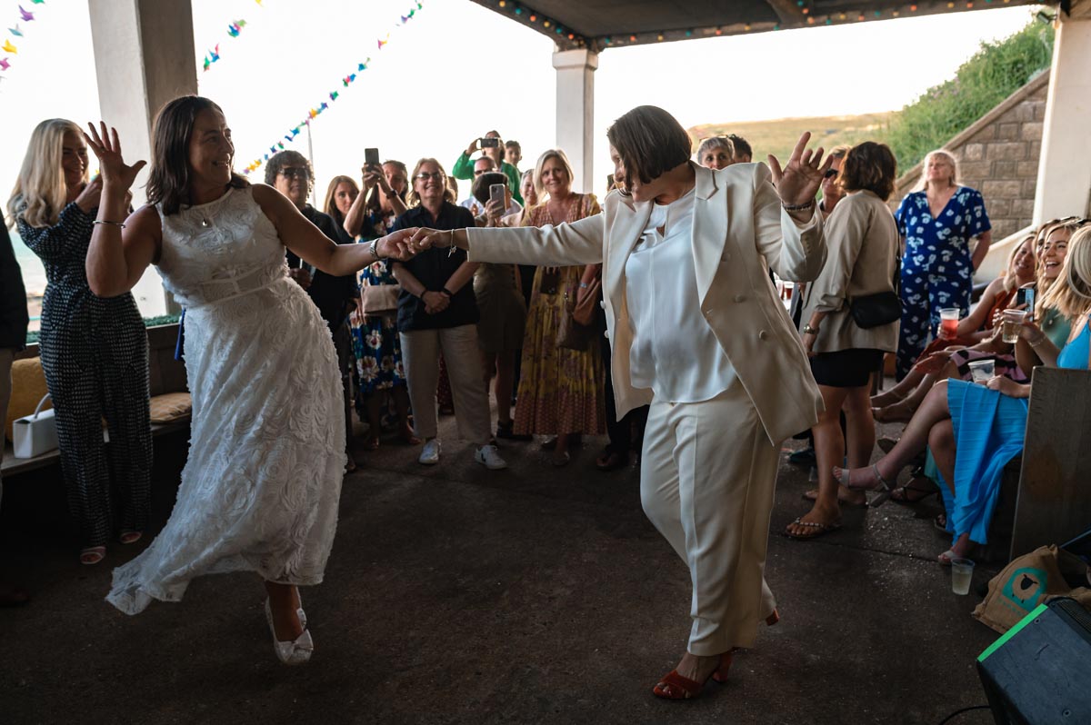 Brides photographed doing first dance at wedding reception in Saltdean east Sussex