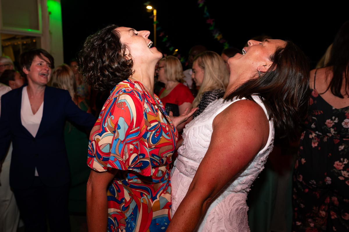 Bride and her sister dancing at wedding reception in Saltdean