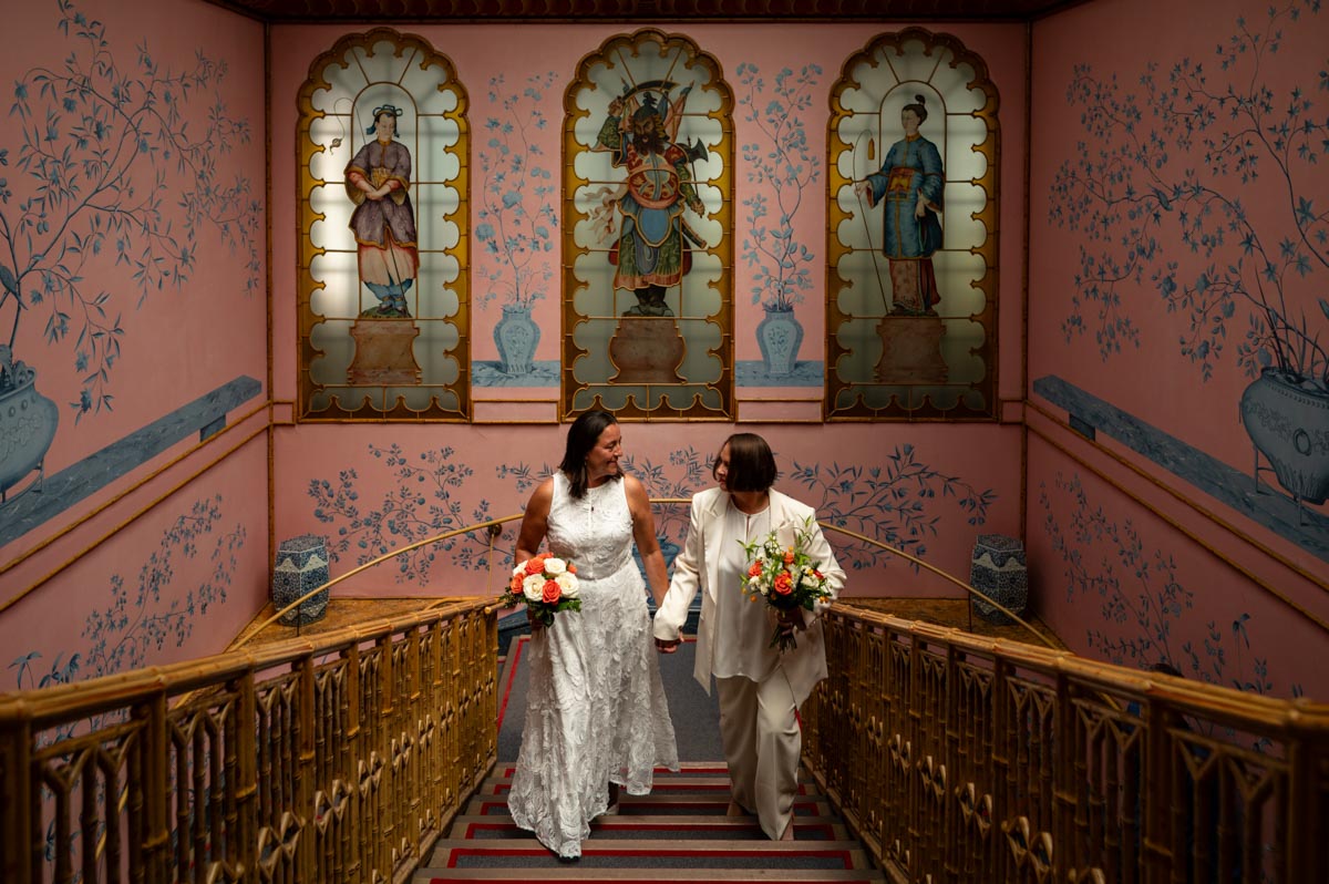 Couple photographed on the staircase at Brighton Royal Pavillion wedding