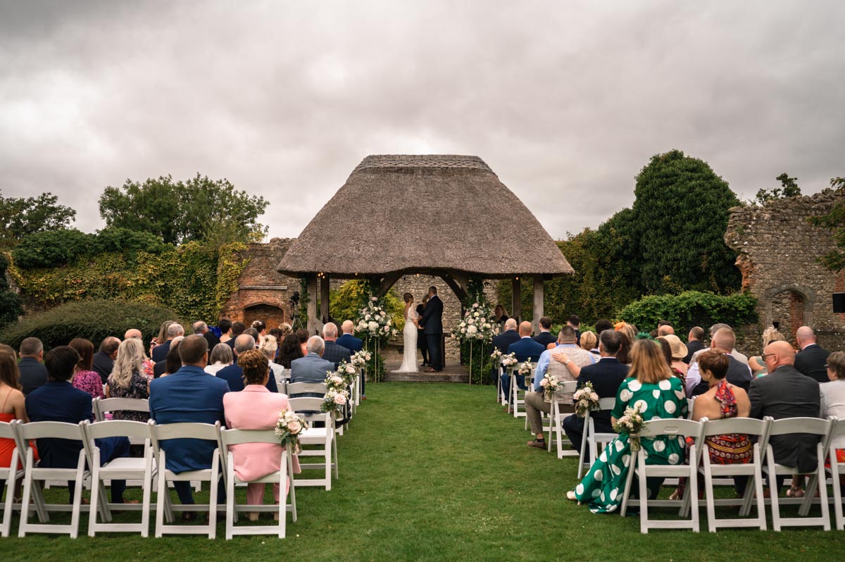 view of outdoor ceremony at westenhanger castle wedding venue in Kent