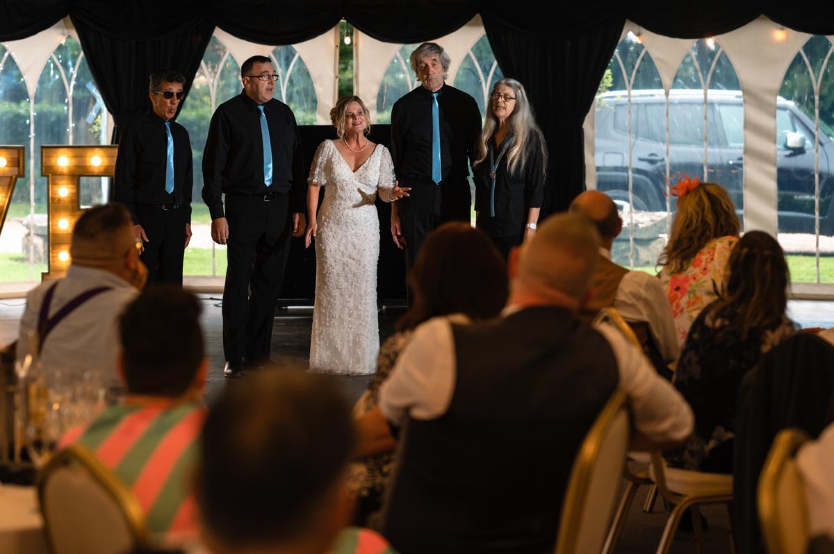 lara sings during her wedding at westenhanger castle in kent