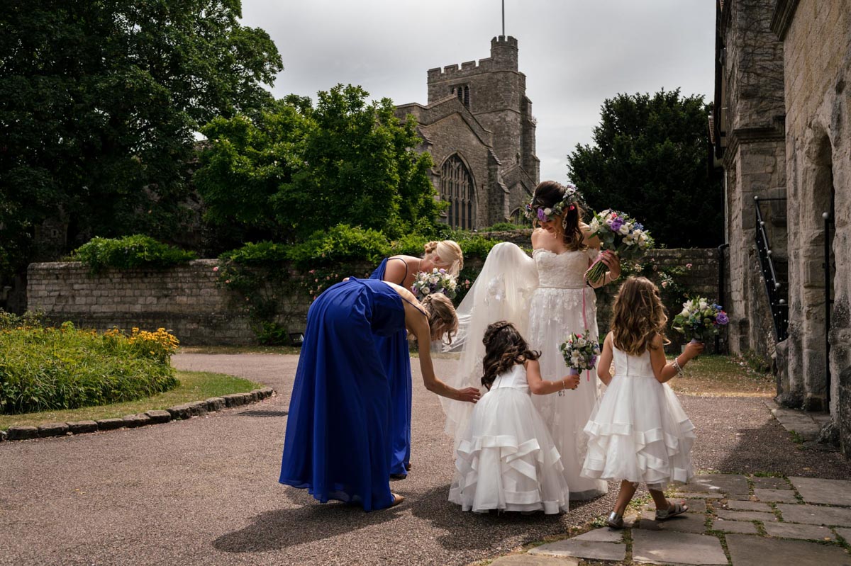 How I approach photographing your wedding includes moments with brides, bridesmaids and flowergirls