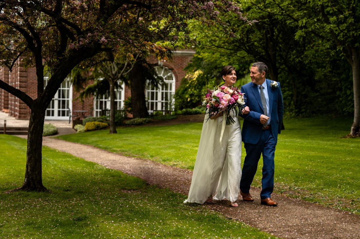 The Orangery wedding venue, Maidstone in Kent. Bride and dad before the ceremony.