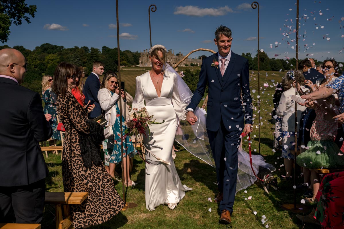 Wedding confetti photograph. Sarah and Matthews outdoor wedding at Little Bayham in Kent