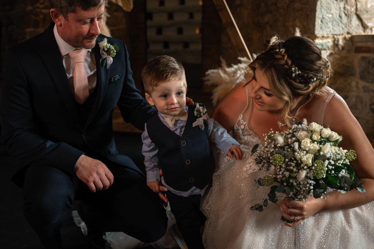 photograph of paige, david and reece after their wedding ceremony at westenhanger castle in kent