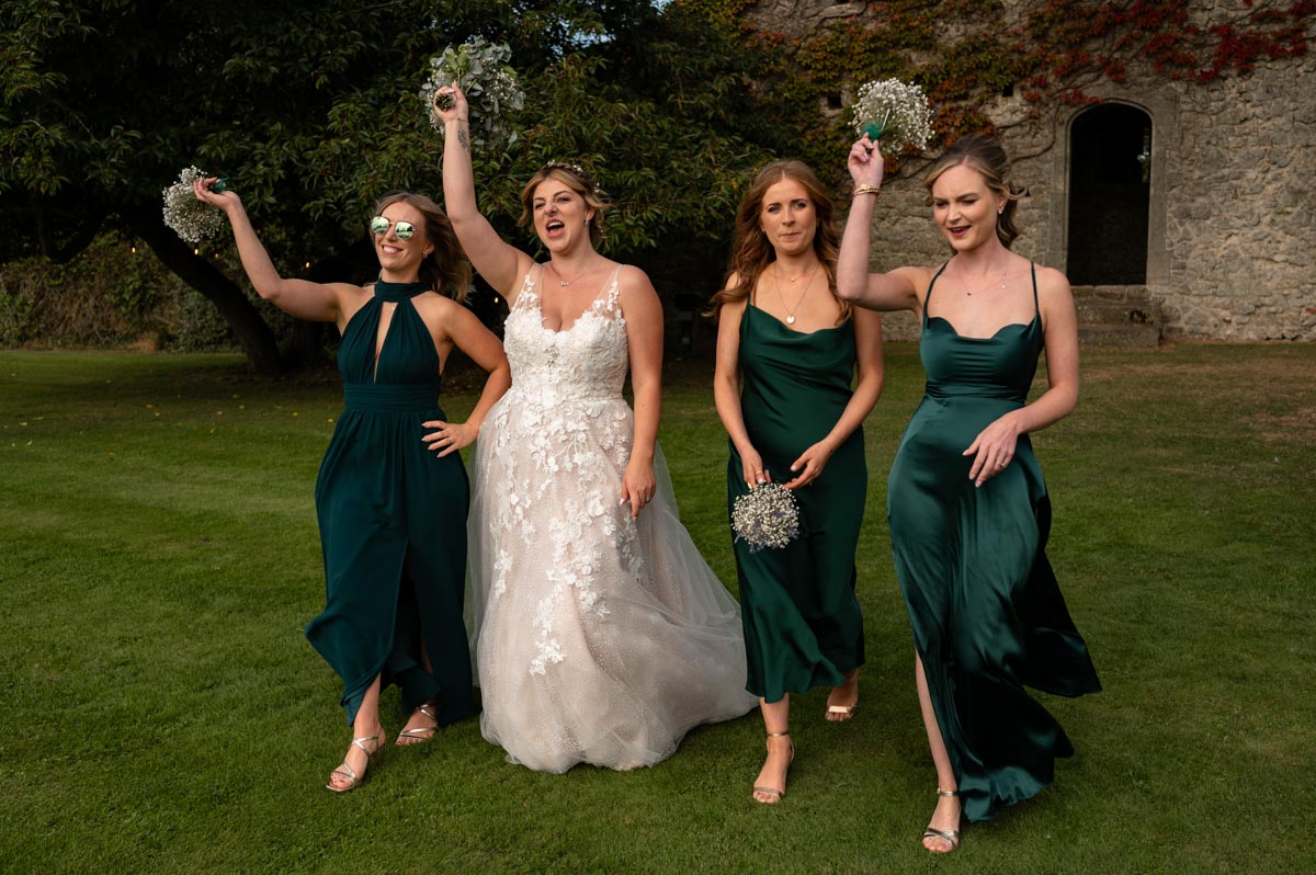 fun photo of bride and her bridesmaids at westenhanger castle in kent