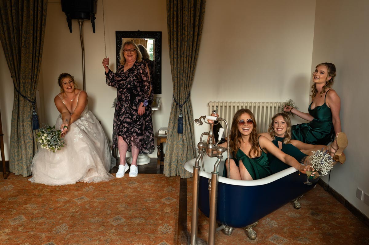 fun group photo at westenhanger castle wedding in the bathroom