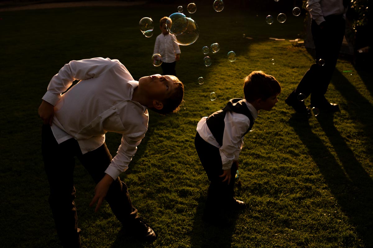 children play in bubbles at westenhanger castle wedding