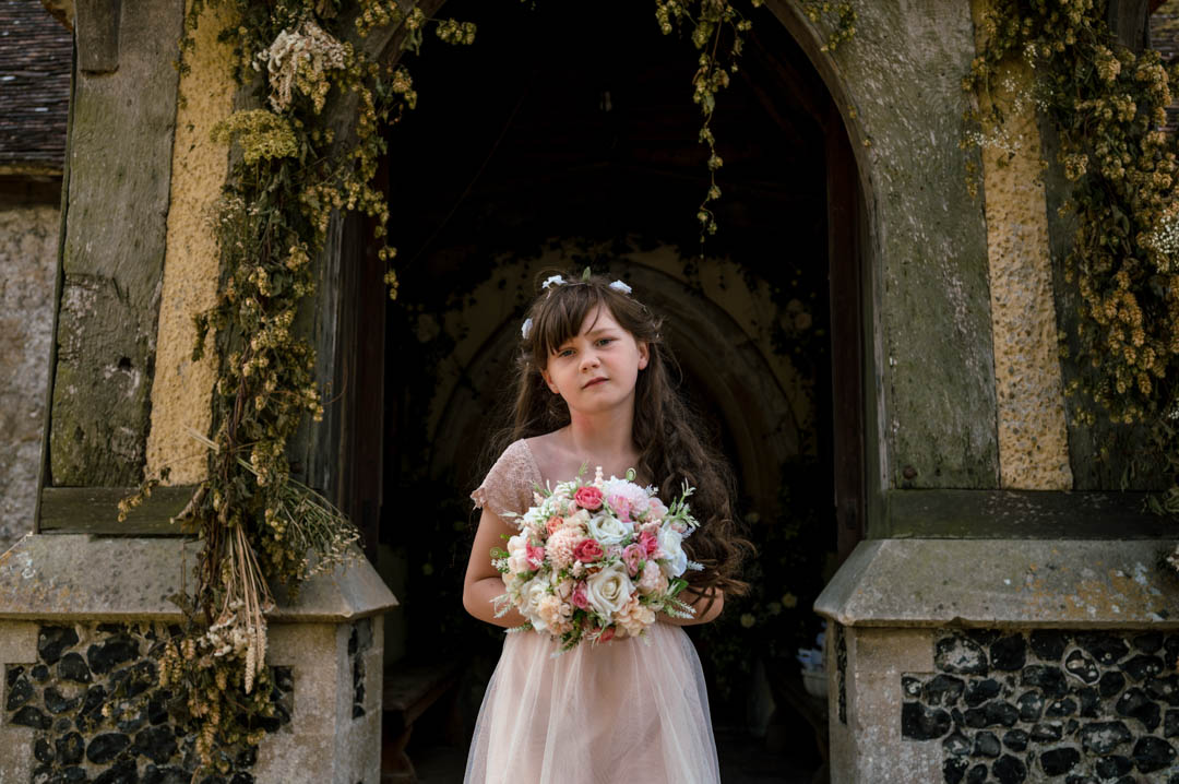 Flowergirl at Jade and Richards small church wedding in Kent