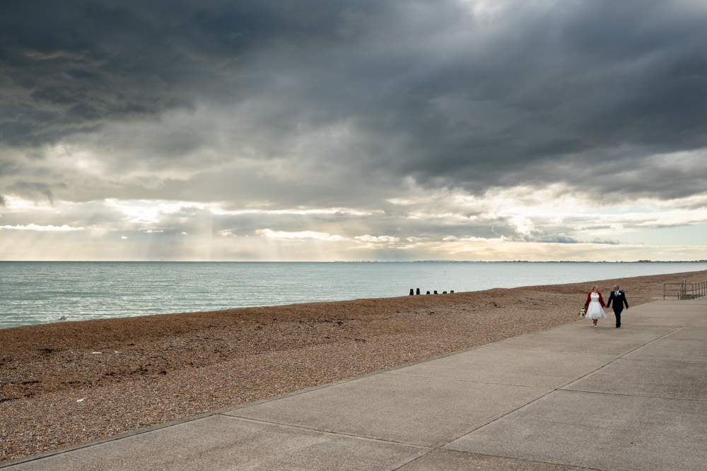 Bride and groom photographed in Sandgate, Kent after their intimate wedding.
